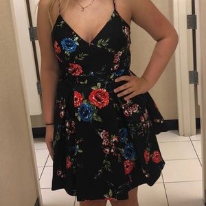 Black formal dress with floral design.